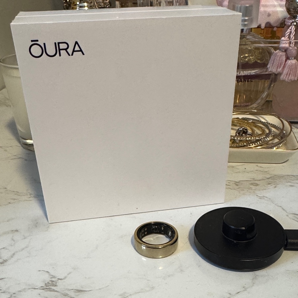 Oura Gold Tone Smart Ring with Black Charger